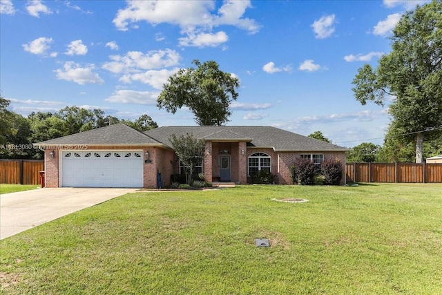 3661 Misty, Woods, FL 32571 - single story home with a garage, concrete driveway, brick siding, and a shingled roof