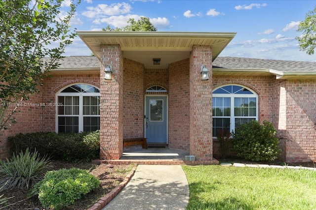 3661 Misty, Woods, FL 32571 - doorway to property with roof with shingles and brick siding
