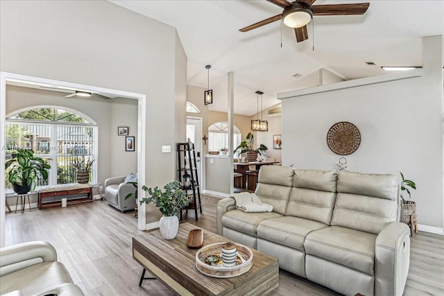 3661 Misty, Woods, FL 32571 - living room with ceiling fan, light wood-style floors, vaulted ceiling, and baseboards