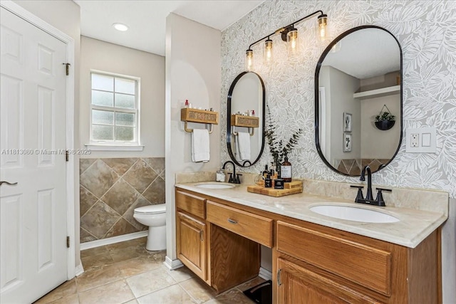 3661 Misty, Woods, FL 32571 - full bathroom featuring wallpapered walls, double vanity, and toilet