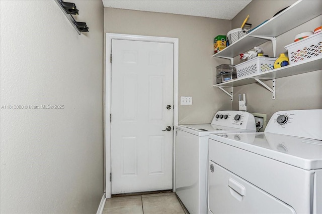 3661 Misty, Woods, FL 32571 - laundry room featuring washing machine and dryer and light tile patterned floors