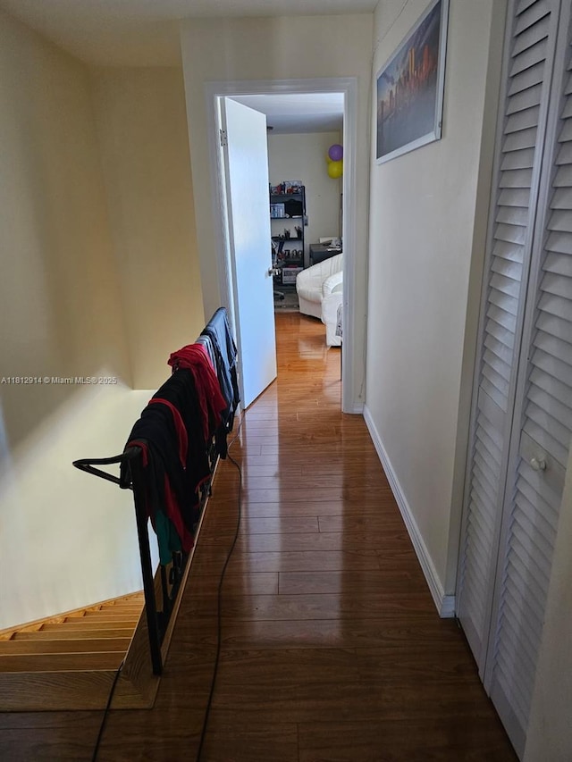 2418 NE 10th St Unit 127, Hallandale Beach, FL 33009 - hallway with hardwood / wood-style flooring and baseboards