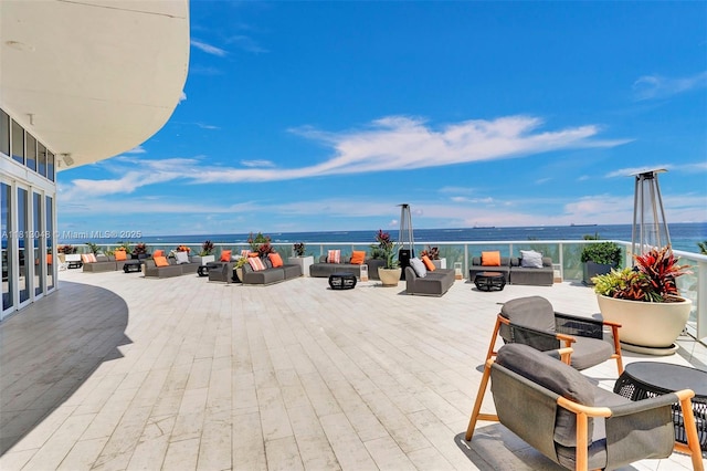 3101 Bayshore Dr Unit 1208, Fort Lauderdale, FL 33304 - view of patio / terrace with an outdoor living space with a fire pit and a water view