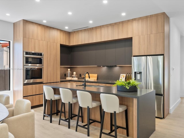 1735 SW 24th Ter, Miami, FL 33145 - kitchen with stainless steel appliances, modern cabinets, a sink, and recessed lighting