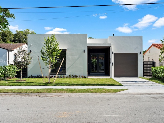 1735 SW 24th Ter, Miami, FL 33145 - contemporary home featuring a garage, stucco siding, and concrete driveway