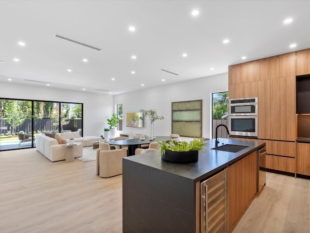 1735 SW 24th Ter, Miami, FL 33145 - kitchen with modern cabinets, beverage cooler, a sink, dark countertops, and recessed lighting