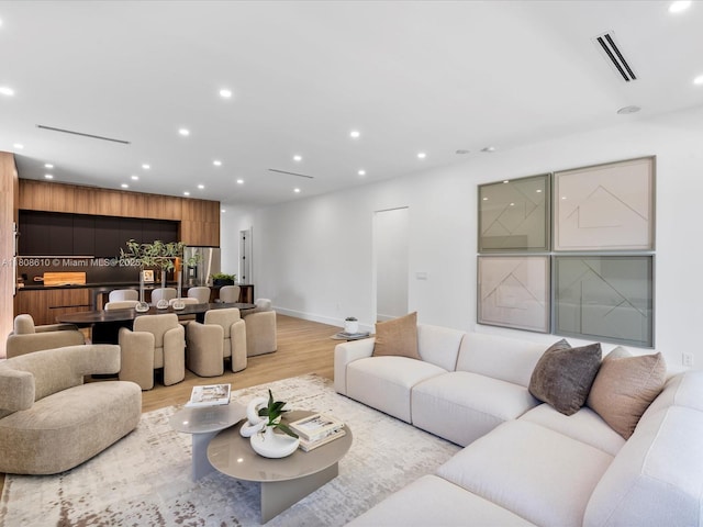 1735 SW 24th Ter, Miami, FL 33145 - living room featuring light wood-type flooring, baseboards, and recessed lighting