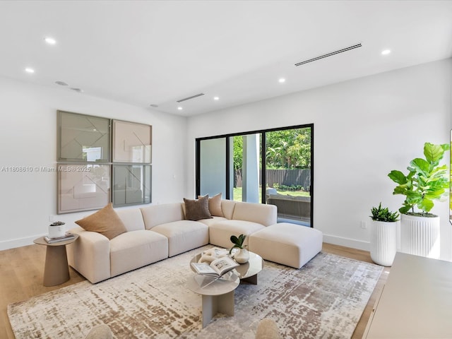 1735 SW 24th Ter, Miami, FL 33145 - living room featuring recessed lighting, baseboards, and wood finished floors