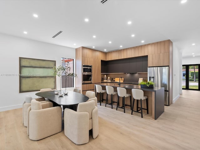 1735 SW 24th Ter, Miami, FL 33145 - dining space with recessed lighting, light wood-style flooring, and baseboards