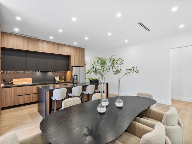 1735 SW 24th Ter, Miami, FL 33145 - dining room featuring recessed lighting, light wood finished floors, and baseboards