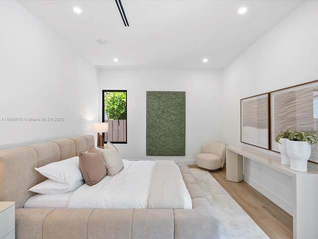 1735 SW 24th Ter, Miami, FL 33145 - bedroom with light wood finished floors, recessed lighting, and baseboards