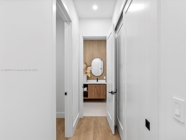 1735 SW 24th Ter, Miami, FL 33145 - hallway featuring light wood finished floors and baseboards