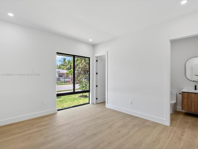 1735 SW 24th Ter, Miami, FL 33145 - empty room with light wood-style floors, recessed lighting, baseboards, and a sink
