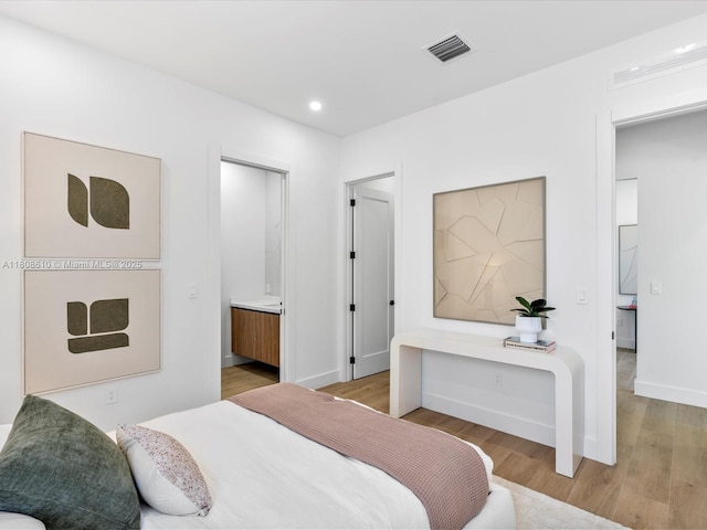 1735 SW 24th Ter, Miami, FL 33145 - bedroom featuring light wood-type flooring, recessed lighting, and baseboards