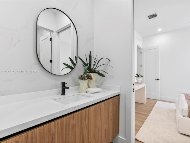 1735 SW 24th Ter, Miami, FL 33145 - bathroom featuring vanity and wood finished floors