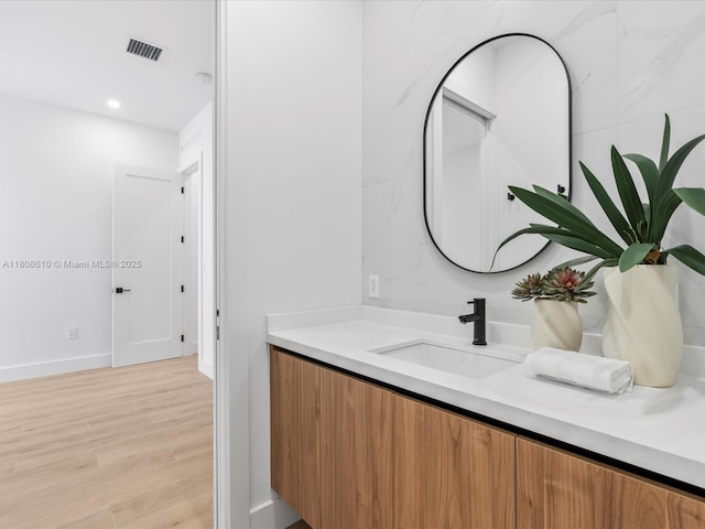 1735 SW 24th Ter, Miami, FL 33145 - bathroom with vanity, wood finished floors, baseboards, and recessed lighting