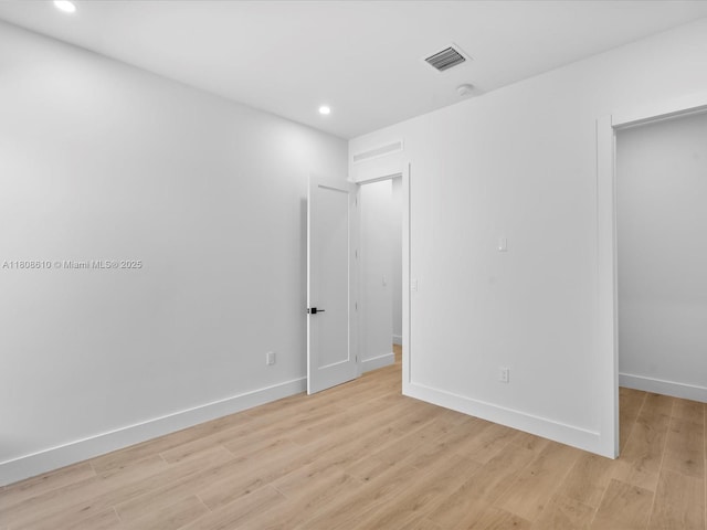 1735 SW 24th Ter, Miami, FL 33145 - unfurnished bedroom with light wood-style flooring, recessed lighting, and baseboards