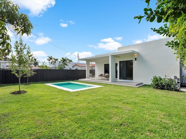 1735 SW 24th Ter, Miami, FL 33145 - rear view of property featuring stucco siding and a patio area