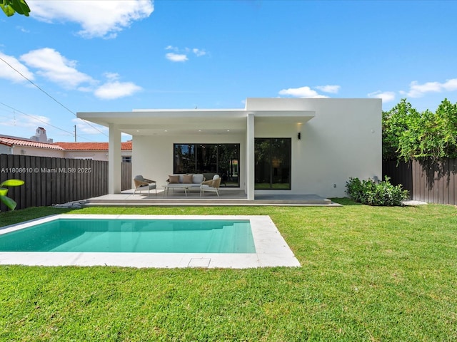 1735 SW 24th Ter, Miami, FL 33145 - back of house with outdoor lounge area, stucco siding, and a patio area