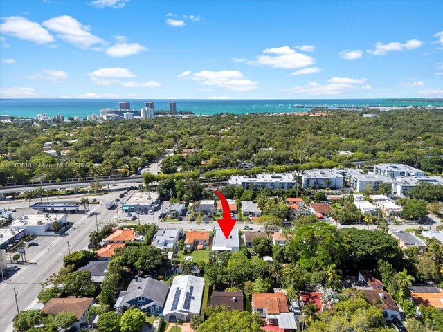 1735 SW 24th Ter, Miami, FL 33145 - aerial perspective of suburban area featuring a large body of water and a tree filled landscape