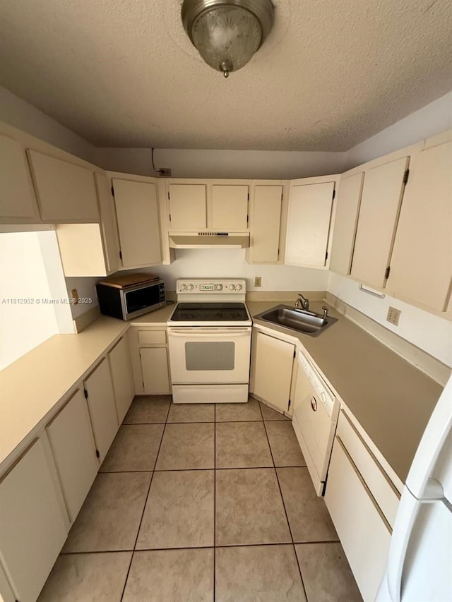 721 Sunny Pine Way Unit D2, Green Acres, FL 33415 - kitchen with white appliances, a sink, under cabinet range hood, a textured ceiling, and light countertops