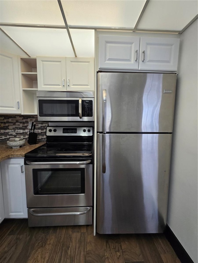 17890 W Dixie Hwy Unit 302, Miami, FL 33160 - kitchen with appliances with stainless steel finishes, white cabinetry, open shelves, dark wood-style flooring, and backsplash