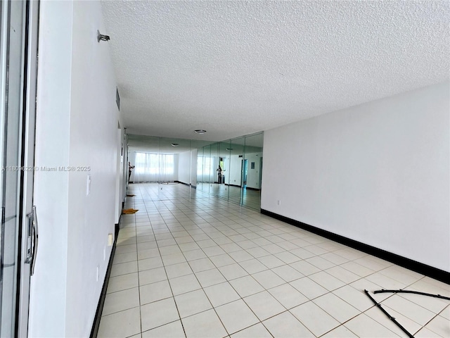 17890 W Dixie Hwy Unit 302, Miami, FL 33160 - unfurnished room featuring a textured ceiling and baseboards