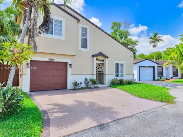 6566 NW 197th Ln, Hialeah, FL 33015 - view of front of house featuring driveway and stucco siding