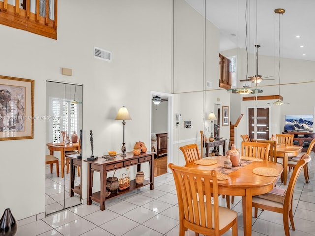 6566 NW 197th Ln, Hialeah, FL 33015 - dining space with a towering ceiling, ceiling fan, and light tile patterned floors