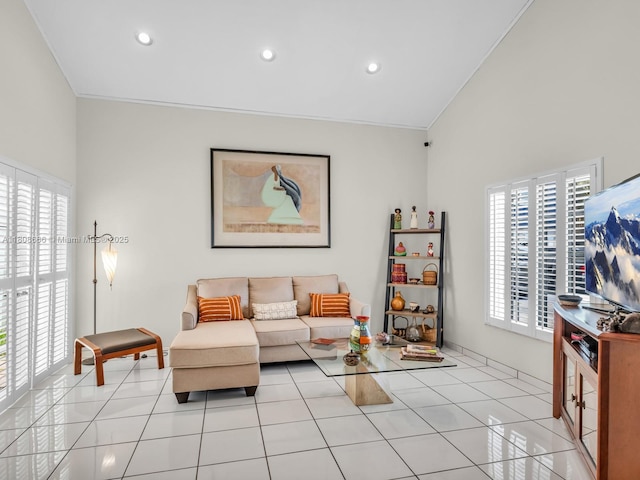 6566 NW 197th Ln, Hialeah, FL 33015 - living room featuring plenty of natural light, lofted ceiling, recessed lighting, light tile patterned floors, and crown molding