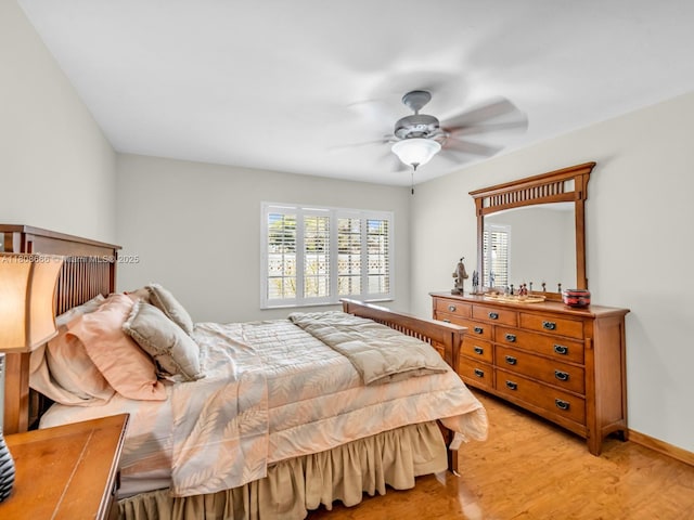 6566 NW 197th Ln, Hialeah, FL 33015 - bedroom with light wood finished floors and a ceiling fan
