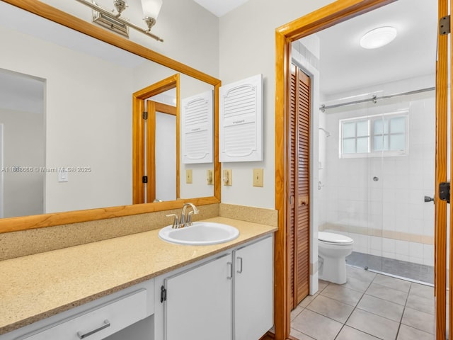6566 NW 197th Ln, Hialeah, FL 33015 - bathroom featuring toilet, vanity, tile patterned flooring, and tiled shower