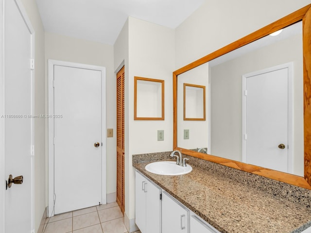6566 NW 197th Ln, Hialeah, FL 33015 - bathroom with vanity, tile patterned flooring, and baseboards