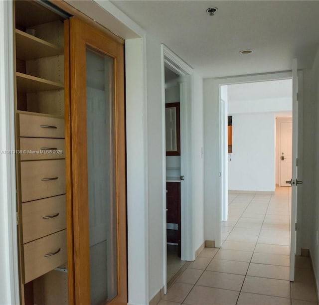 1650 Coral Way Unit 512, Miami, FL 33145 - hall featuring light tile patterned floors and baseboards