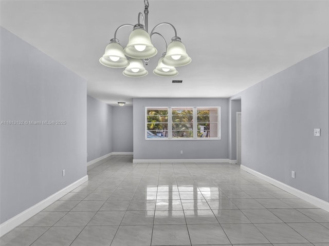 6525 SW 18th St, Miramar, FL 33023 - tiled empty room featuring a chandelier and baseboards