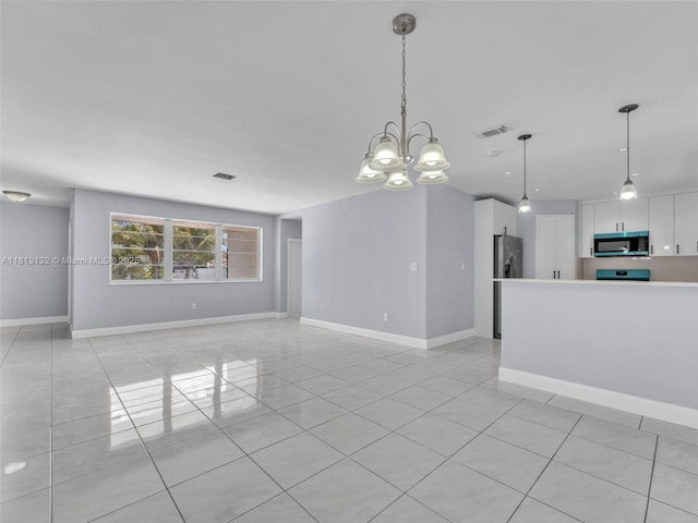 6525 SW 18th St, Miramar, FL 33023 - unfurnished living room featuring light tile patterned flooring, a chandelier, and baseboards