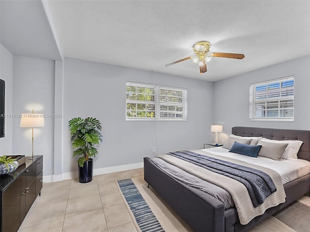 6525 SW 18th St, Miramar, FL 33023 - bedroom with light tile patterned flooring, baseboards, and a ceiling fan
