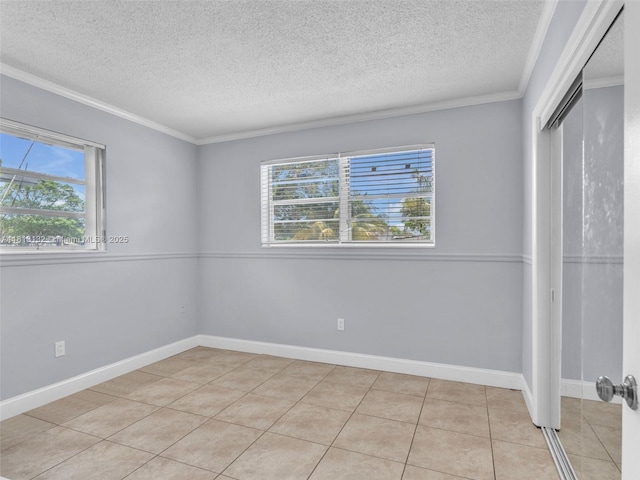 6525 SW 18th St, Miramar, FL 33023 - unfurnished bedroom with a textured ceiling, multiple windows, a closet, crown molding, and light tile patterned flooring