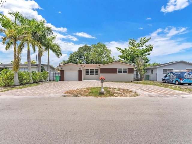 6525 SW 18th St, Miramar, FL 33023 - single story home featuring decorative driveway, an attached garage, and stucco siding