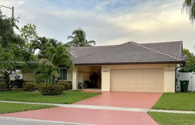 16295 NW 9th Dr, Pembroke Pines, FL 33028 - ranch-style house with a garage, stucco siding, concrete driveway, and a tile roof