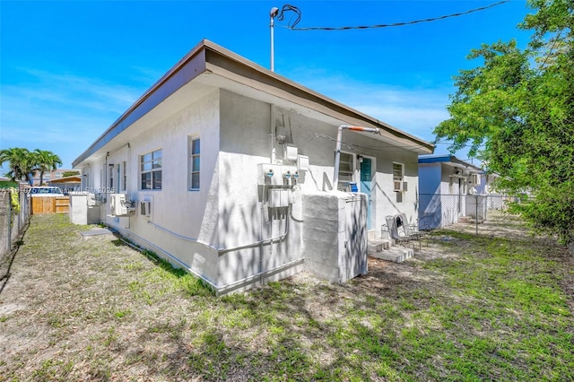 121 SW 5th Ct, Dania Beach, FL 33004 - view of home's exterior with a fenced backyard and stucco siding