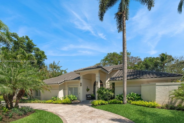 7395 SW 166th St, Palmetto Bay, FL 33157 - mediterranean / spanish-style home featuring a tiled roof, stucco siding, and curved driveway