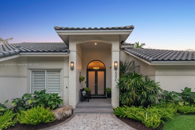 7395 SW 166th St, Palmetto Bay, FL 33157 - doorway to property with a tiled roof, french doors, and stucco siding