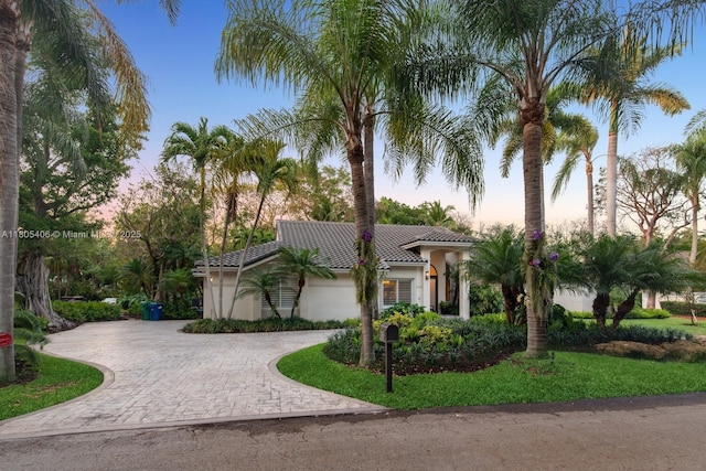 7395 SW 166th St, Palmetto Bay, FL 33157 - mediterranean / spanish home featuring curved driveway, stucco siding, and a tiled roof