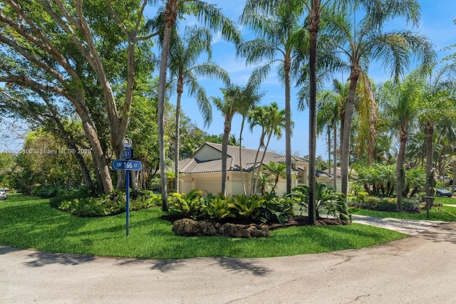 7395 SW 166th St, Palmetto Bay, FL 33157 - view of front of property with stucco siding, a front yard, and a garage