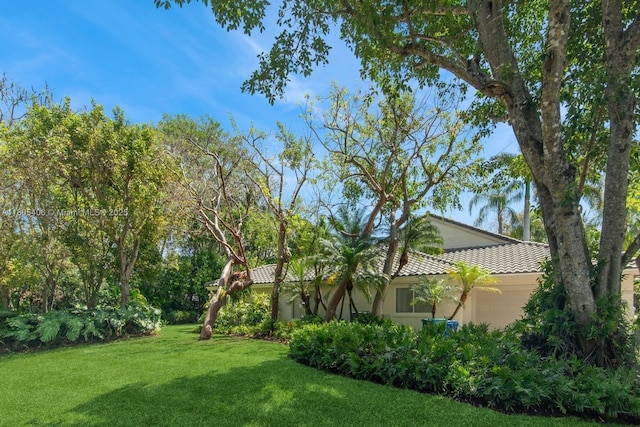 7395 SW 166th St, Palmetto Bay, FL 33157 - view of green lawn featuring an attached garage