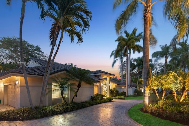 7395 SW 166th St, Palmetto Bay, FL 33157 - view of front of property with a tile roof, decorative driveway, an attached garage, and stucco siding