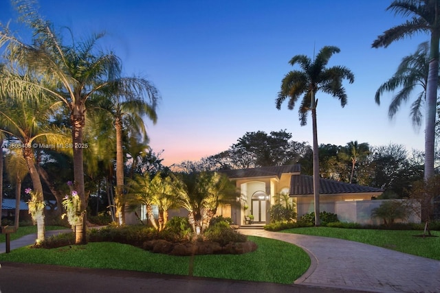 7395 SW 166th St, Palmetto Bay, FL 33157 - mediterranean / spanish-style house featuring curved driveway and stucco siding