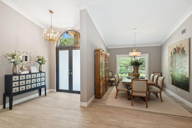 7395 SW 166th St, Palmetto Bay, FL 33157 - dining room with crown molding, french doors, a chandelier, light wood-style flooring, and baseboards