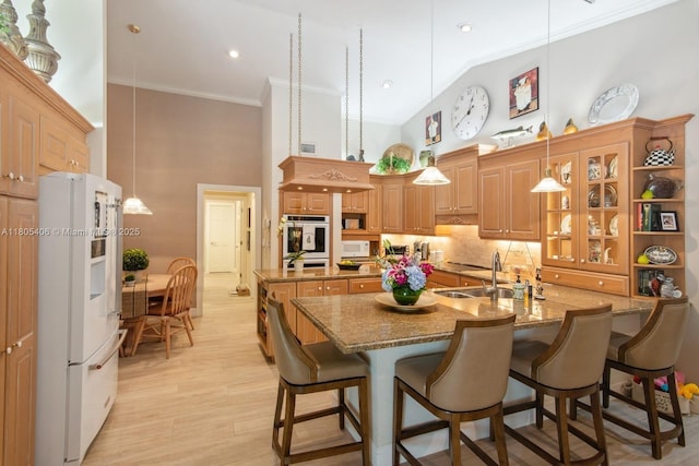 7395 SW 166th St, Palmetto Bay, FL 33157 - kitchen featuring white appliances, a high ceiling, crown molding, a sink, and a center island with sink